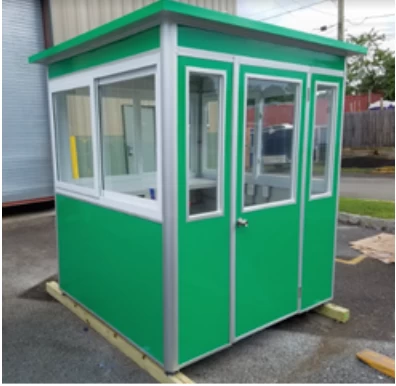 A green booth with a closed swinging door