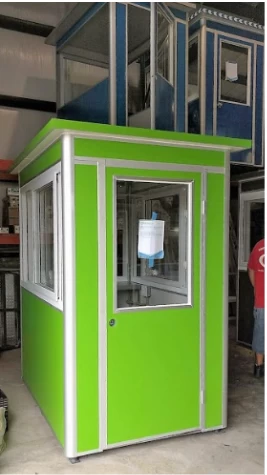 A green guard booth in a warehouse