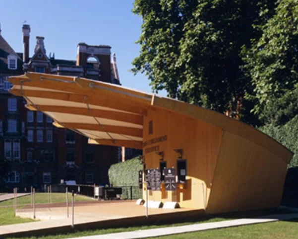 A large wooden ticket booth with large rain awning