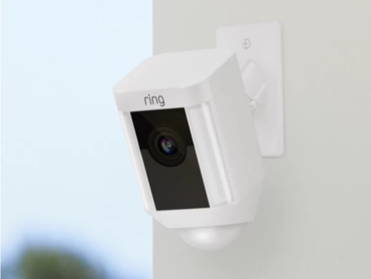 A white Ring video camera on a white wall