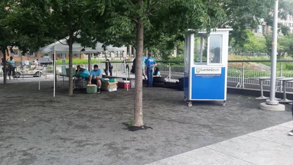 Blue ticket booth in a park - Maximize Profits in Amusement Park Management Systems