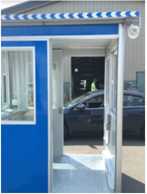 Looking straight through a blue booth with dual open sliding doors