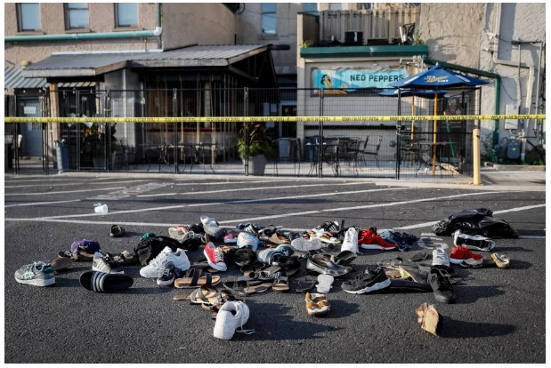 shoes piled up near the site of the Dayton, Ohio shooting, August 4, 2019