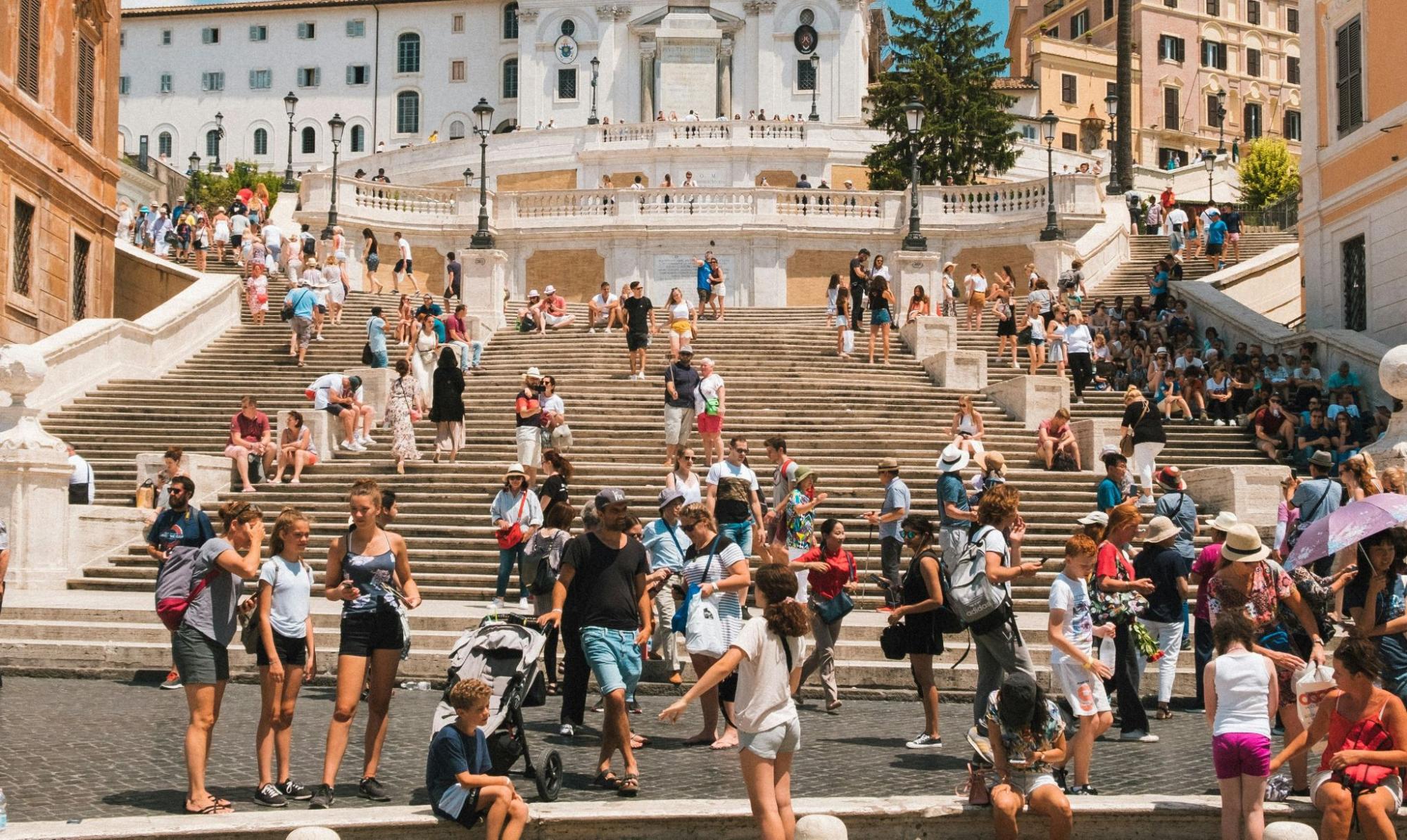 Tourists at destination where tourism information kiosks enhance tourist experience