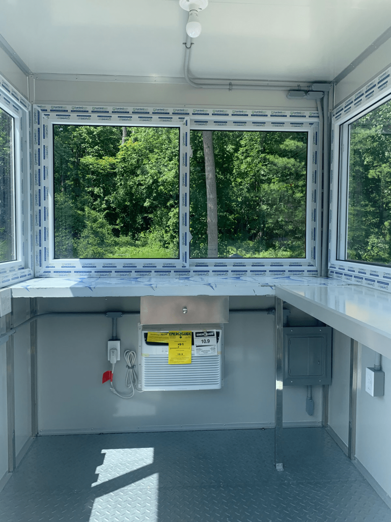 Desk in interior of modular building for pop-up shops